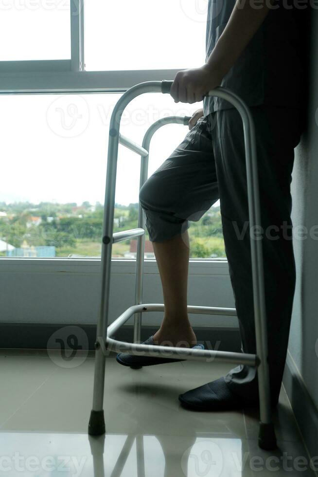 Physiotherapist is doing physical therapy for a patient, the patient has body aches due to overwork and has undergone treatment and physiotherapy with a professional physiotherapist. photo