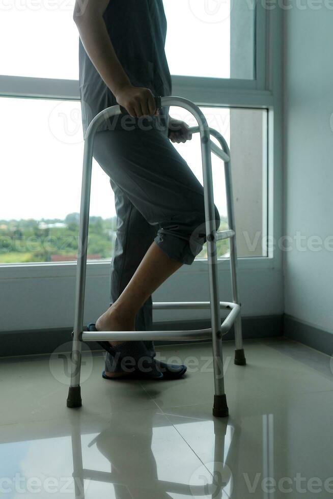 Physiotherapist is doing physical therapy for a patient, the patient has body aches due to overwork and has undergone treatment and physiotherapy with a professional physiotherapist. photo