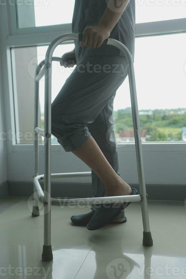 Physiotherapist is doing physical therapy for a patient, the patient has body aches due to overwork and has undergone treatment and physiotherapy with a professional physiotherapist. photo