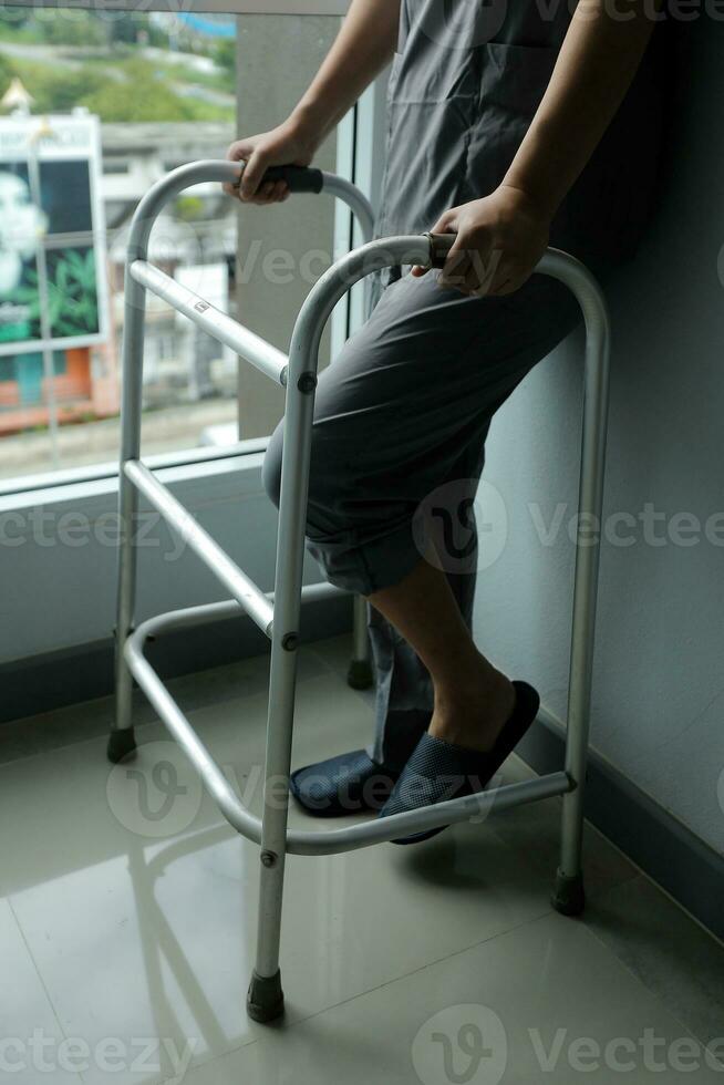 Physiotherapist is doing physical therapy for a patient, the patient has body aches due to overwork and has undergone treatment and physiotherapy with a professional physiotherapist. photo