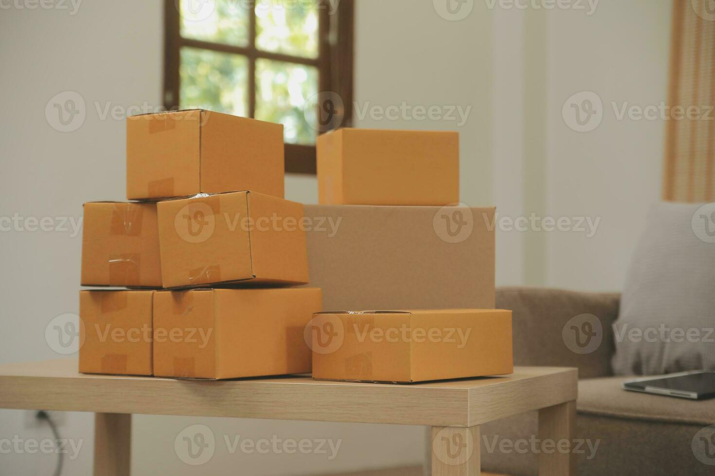 Startup small business owner working with computer at workplace. Freelance two woman seller check product order. Packing goods for delivery to customer. Online selling. E-commerce. Online Shopping photo