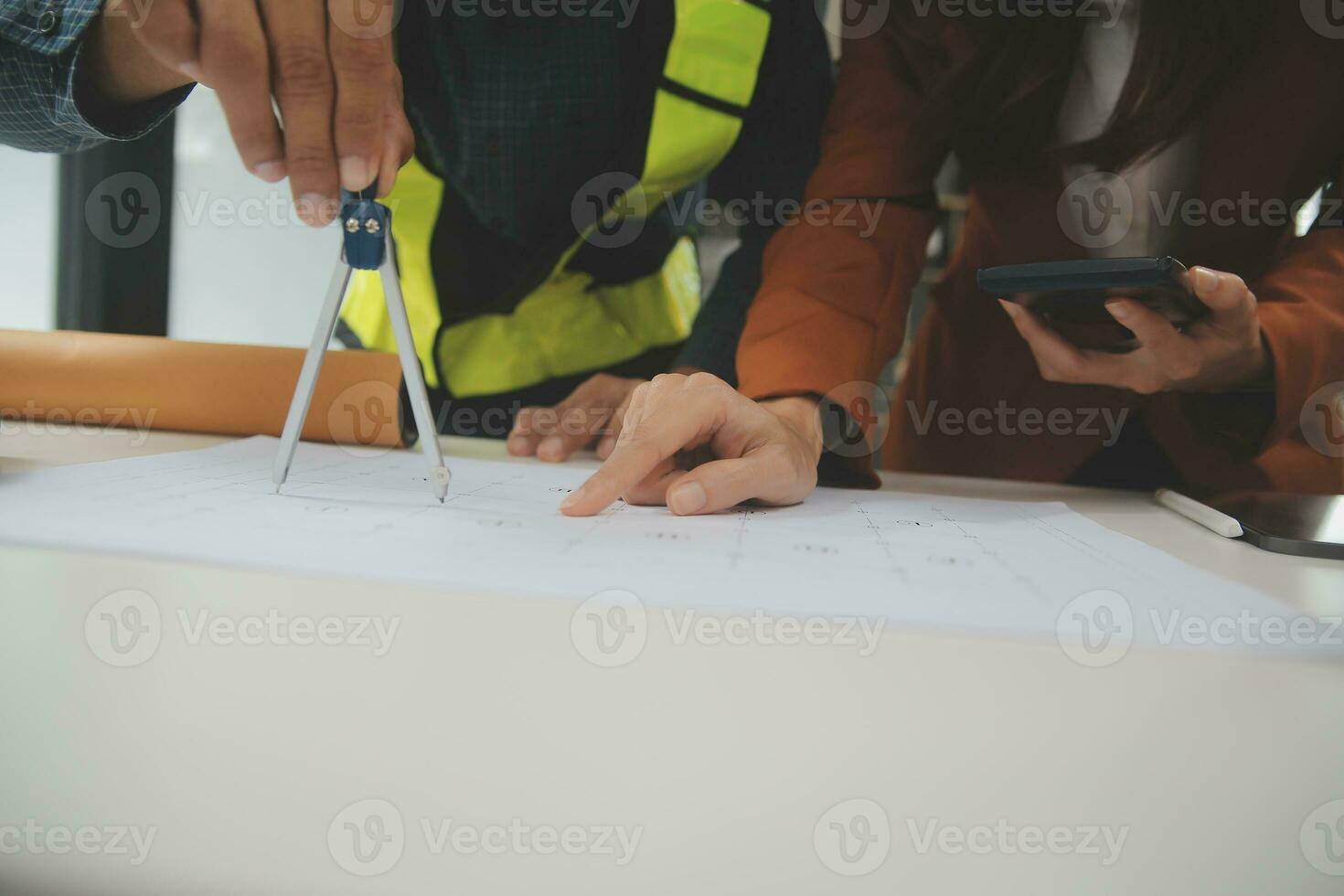 Engineer Teamwork Meeting, Drawing working on blueprint meeting for project working with partner on model building and engineering tools in working site, Construction and structure concept. photo