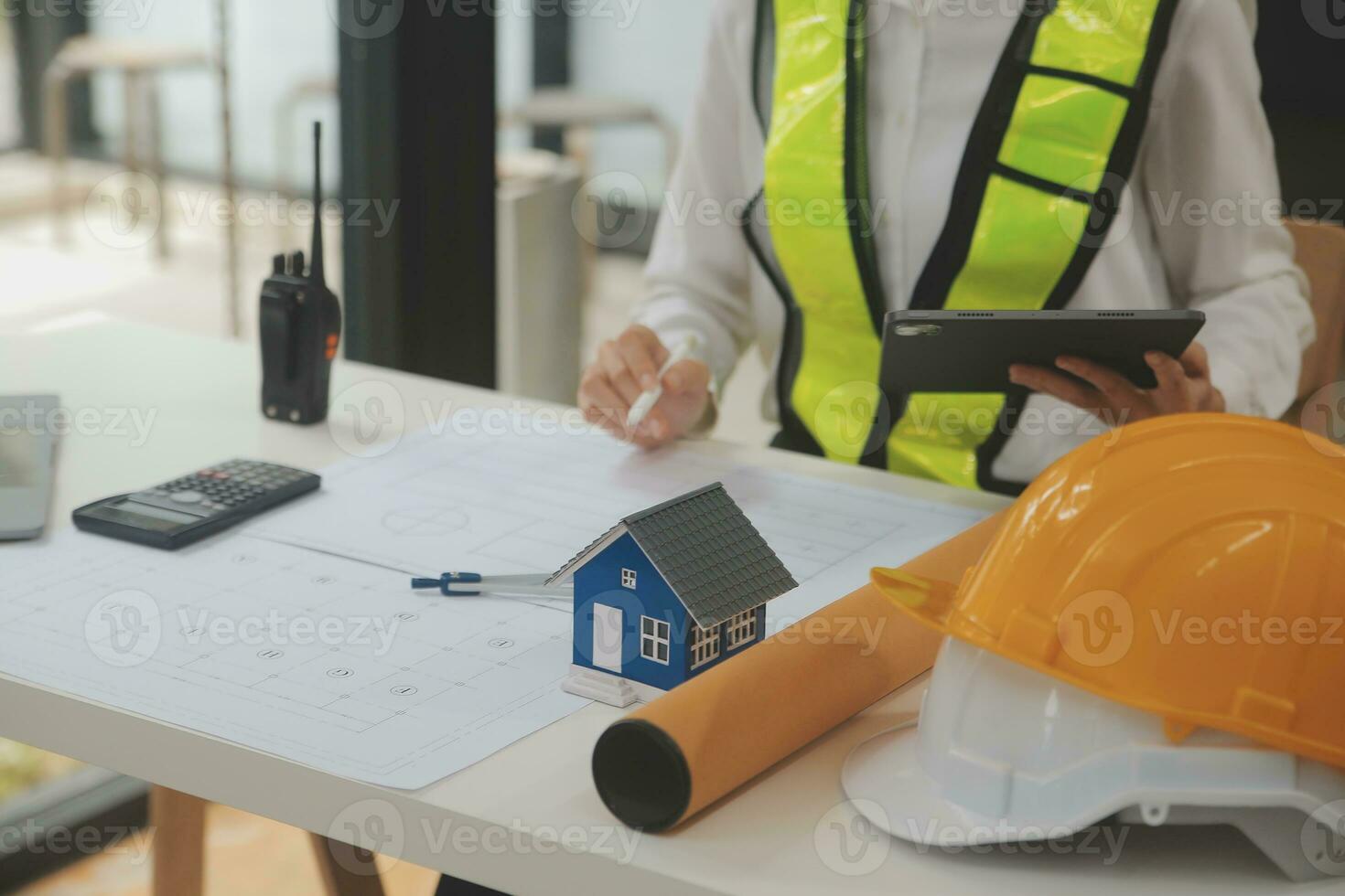 Engineer Teamwork Meeting, Drawing working on blueprint meeting for project working with partner on model building and engineering tools in working site, Construction and structure concept. photo