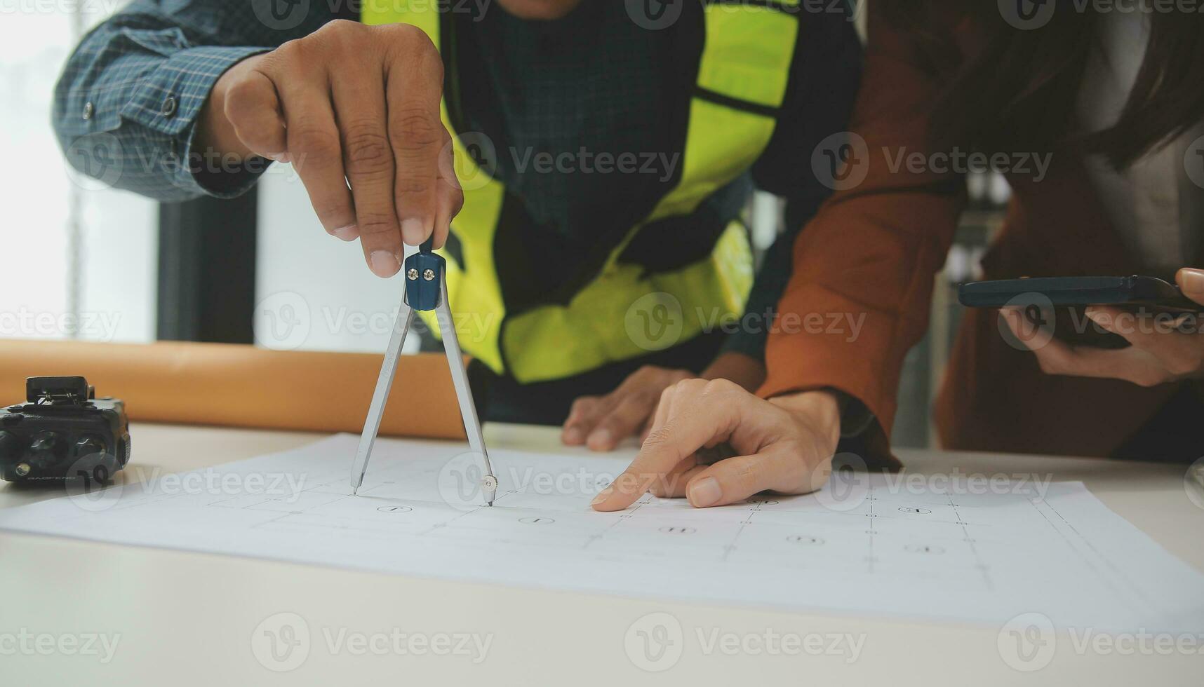 Engineer Teamwork Meeting, Drawing working on blueprint meeting for project working with partner on model building and engineering tools in working site, Construction and structure concept. photo