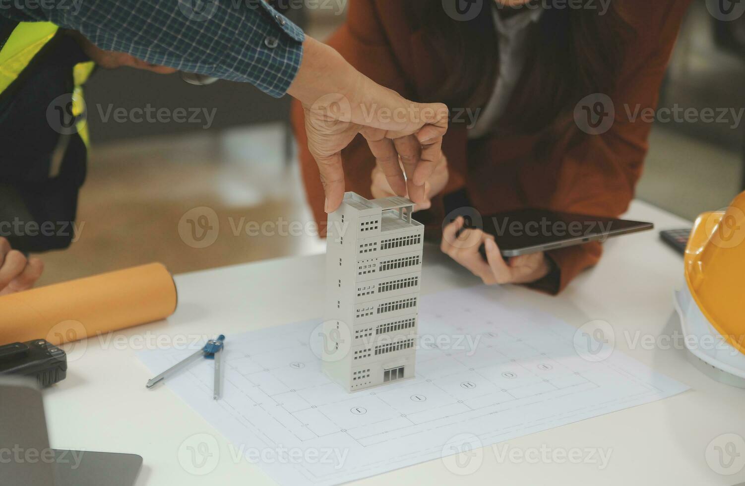 Engineer Teamwork Meeting, Drawing working on blueprint meeting for project working with partner on model building and engineering tools in working site, Construction and structure concept. photo