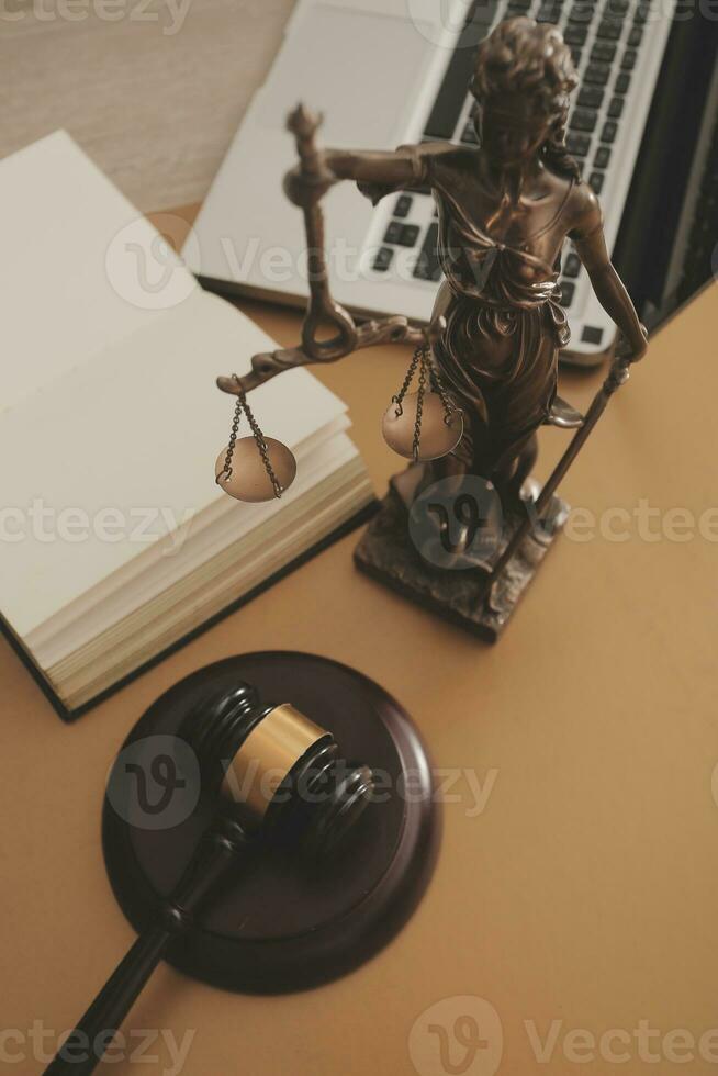 Business and lawyers discussing contract papers with brass scale on desk in office. Law, legal services, advice, justice and law concept picture with film grain effect photo