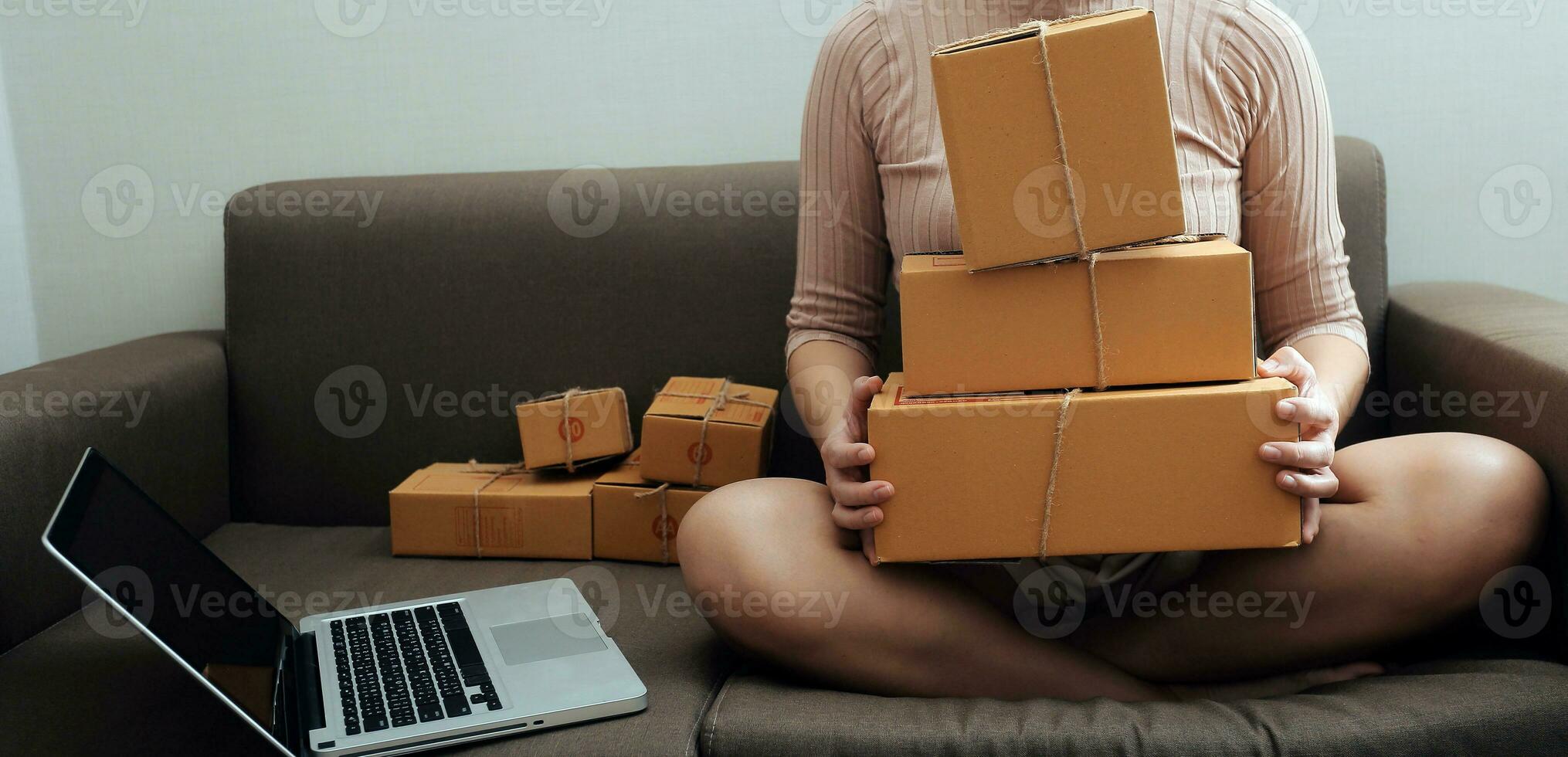 Business woman start up small business entrepreneur SME success .freelance woman working at home with Online Parcel delivery. SME and packaging deliveryconcept photo