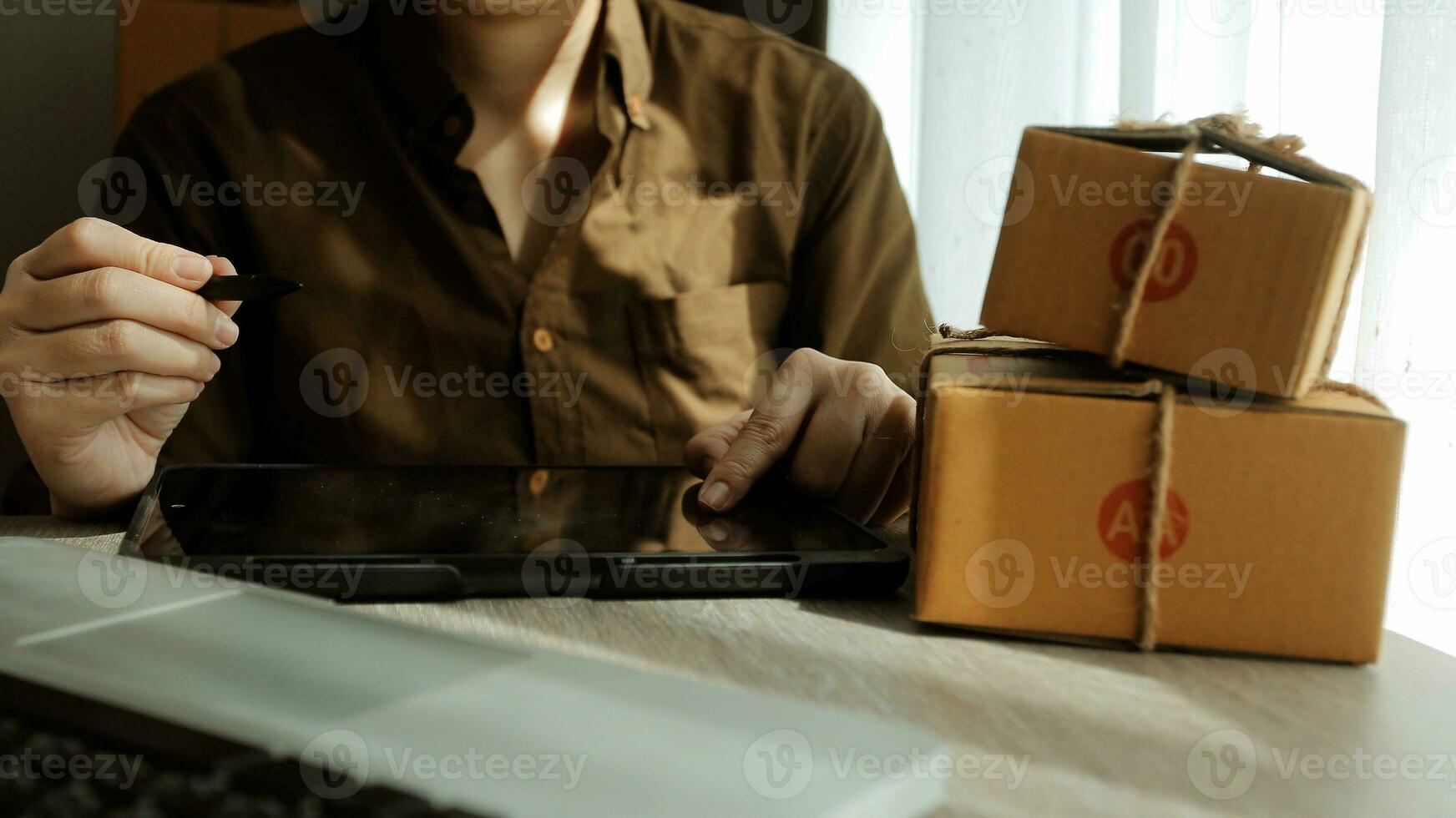 Business woman start up small business entrepreneur SME success .freelance woman working at home with Online Parcel delivery. SME and packaging deliveryconcept photo