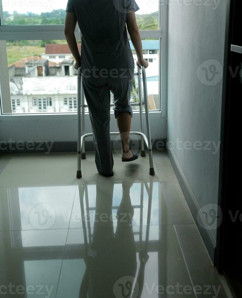 Physiotherapist is doing physical therapy for a patient, the patient has body aches due to overwork and has undergone treatment and physiotherapy with a professional physiotherapist. photo
