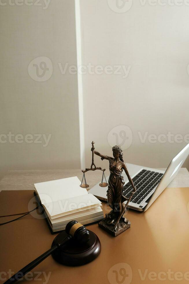 Business and lawyers discussing contract papers with brass scale on desk in office. Law, legal services, advice, justice and law concept picture with film grain effect photo