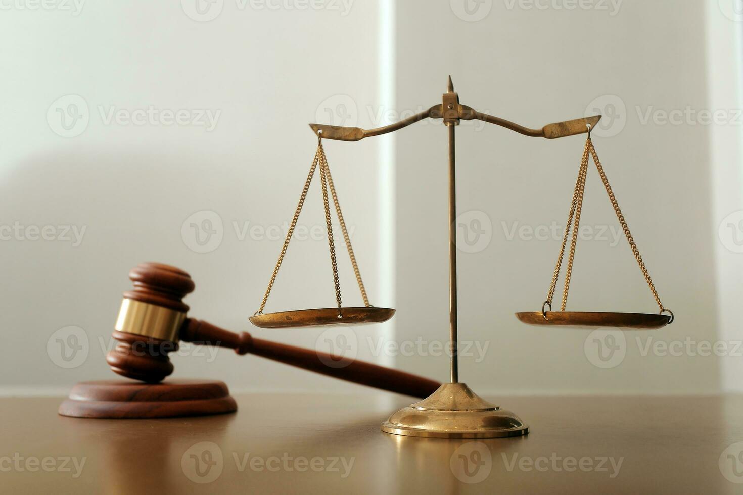 Business and lawyers discussing contract papers with brass scale on desk in office. Law, legal services, advice, justice and law concept picture with film grain effect photo