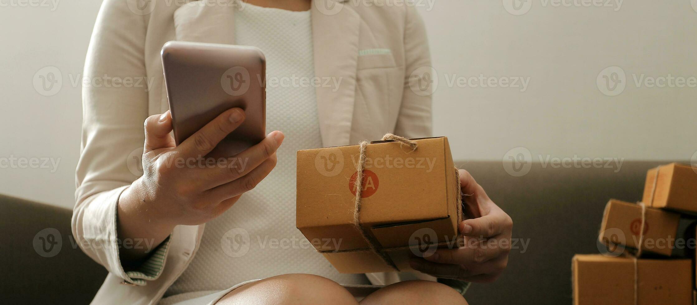 Business woman start up small business entrepreneur SME success .freelance woman working at home with Online Parcel delivery. SME and packaging deliveryconcept photo