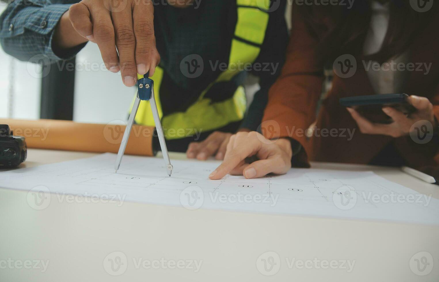 Engineer Teamwork Meeting, Drawing working on blueprint meeting for project working with partner on model building and engineering tools in working site, Construction and structure concept. photo