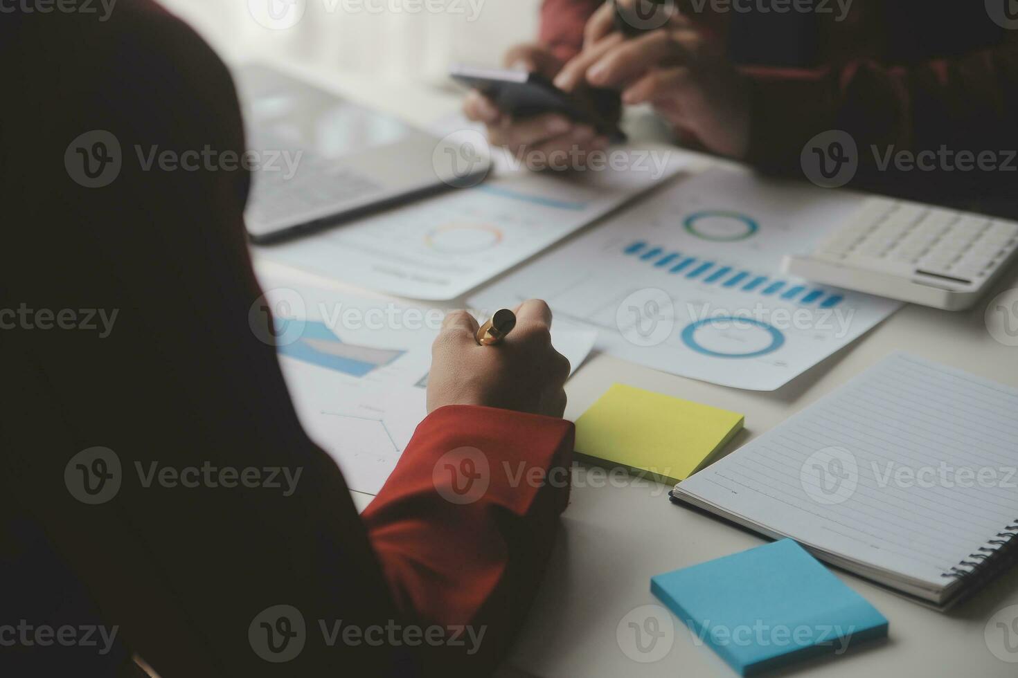 Close up Business woman using calculator and laptop for do math finance on wooden desk, tax, accounting, statistics and analytical research concept photo