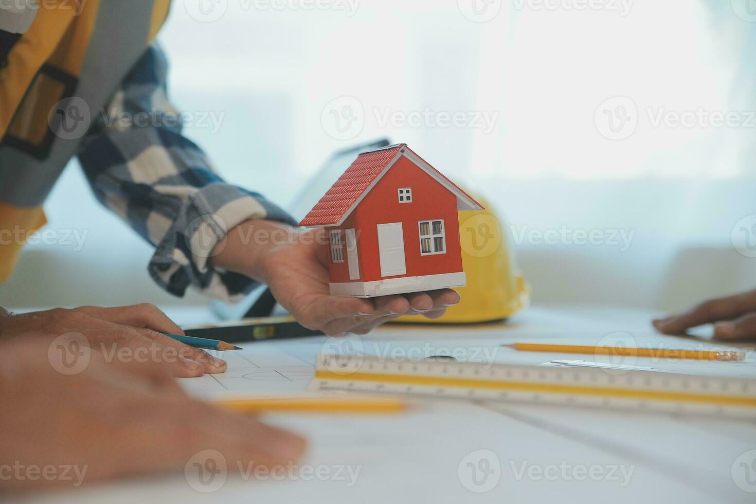 Construction and structure concept of Engineer or architect meeting for project working with partner and engineering tools on model building and blueprint in working site, contract for both companies. photo