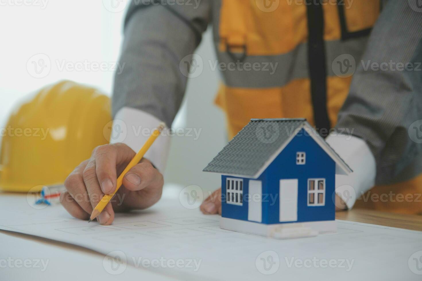 Construction and structure concept of Engineer or architect meeting for project working with partner and engineering tools on model building and blueprint in working site, contract for both companies. photo
