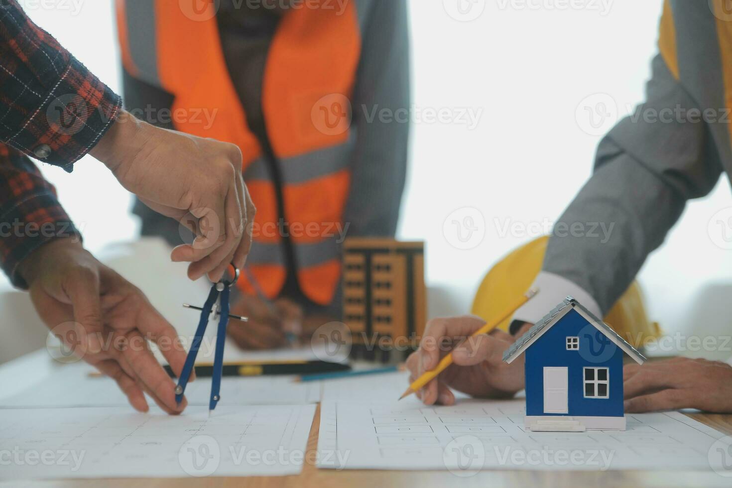 Construction and structure concept of Engineer or architect meeting for project working with partner and engineering tools on model building and blueprint in working site, contract for both companies. photo