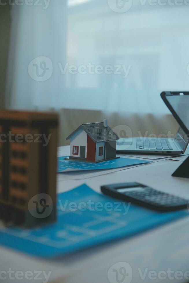 Construction and structure concept of Engineer or architect meeting for project working with partner and engineering tools on model building and blueprint in working site, contract for both companies. photo
