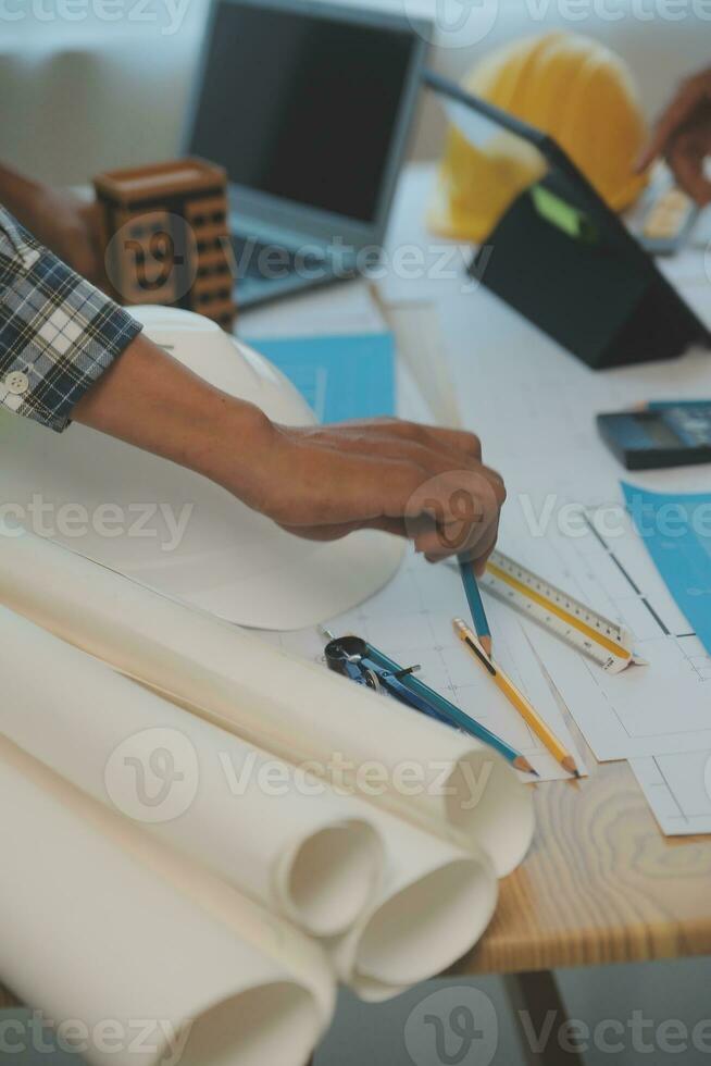 Construction and structure concept of Engineer or architect meeting for project working with partner and engineering tools on model building and blueprint in working site, contract for both companies. photo