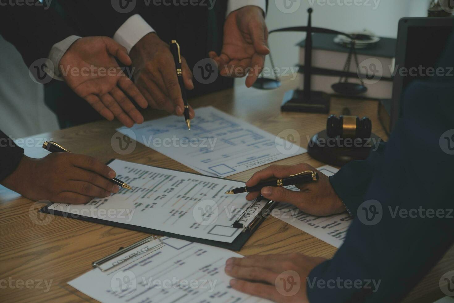 Consultation and conference of Male lawyers and professional businesswoman working and discussion having at law firm in office. Concepts of law, Judge gavel with scales of justice. photo