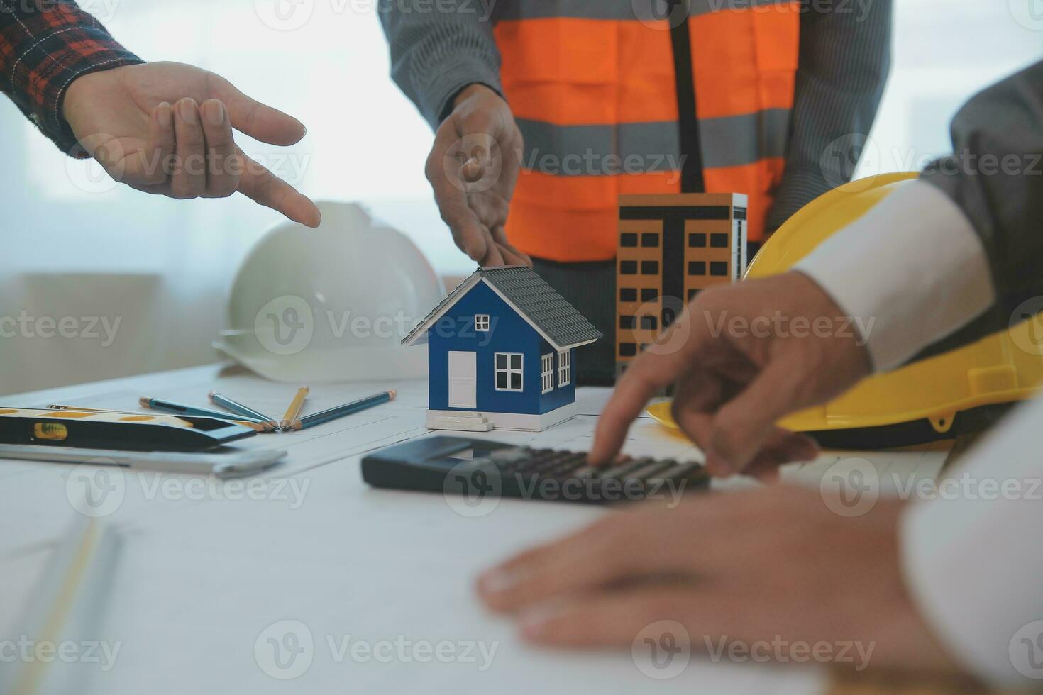 Construction and structure concept of Engineer or architect meeting for project working with partner and engineering tools on model building and blueprint in working site, contract for both companies. photo