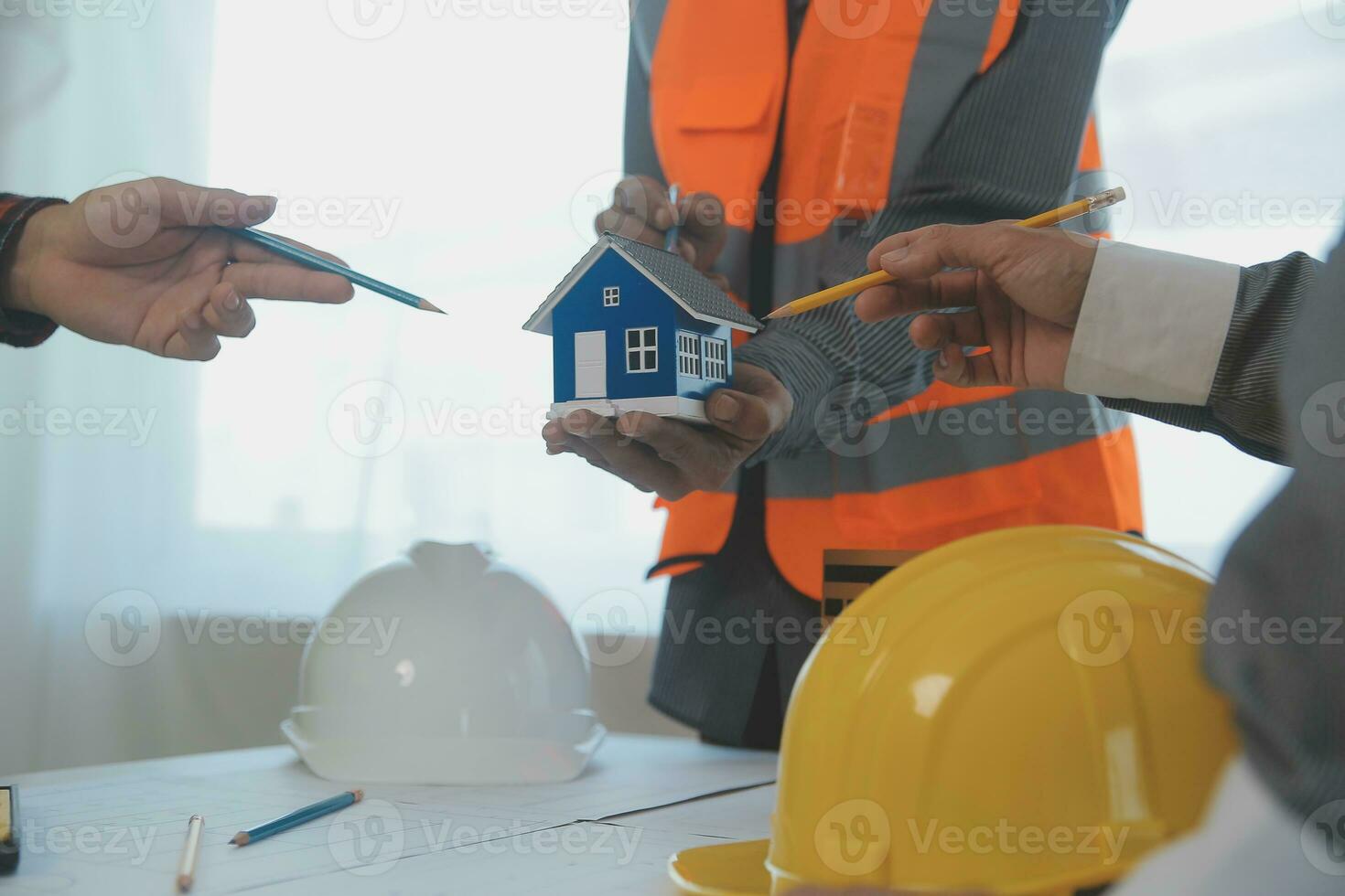 Construction and structure concept of Engineer or architect meeting for project working with partner and engineering tools on model building and blueprint in working site, contract for both companies. photo