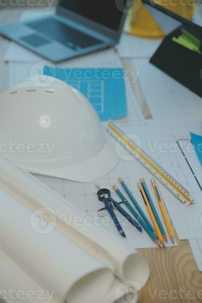 Construction and structure concept of Engineer or architect meeting for project working with partner and engineering tools on model building and blueprint in working site, contract for both companies. photo