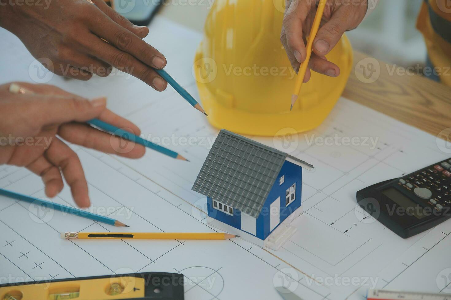 Construction and structure concept of Engineer or architect meeting for project working with partner and engineering tools on model building and blueprint in working site, contract for both companies. photo