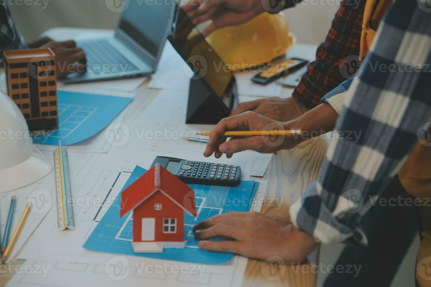 Construction and structure concept of Engineer or architect meeting for project working with partner and engineering tools on model building and blueprint in working site, contract for both companies. photo