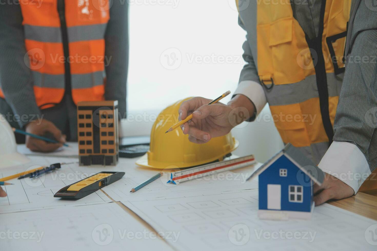 Construction and structure concept of Engineer or architect meeting for project working with partner and engineering tools on model building and blueprint in working site, contract for both companies. photo