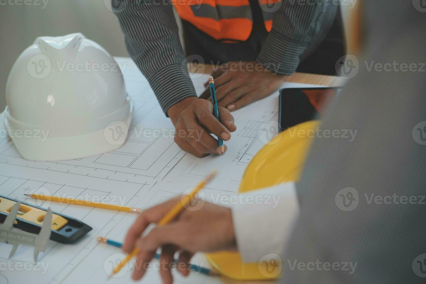 Construction and structure concept of Engineer or architect meeting for project working with partner and engineering tools on model building and blueprint in working site, contract for both companies. photo