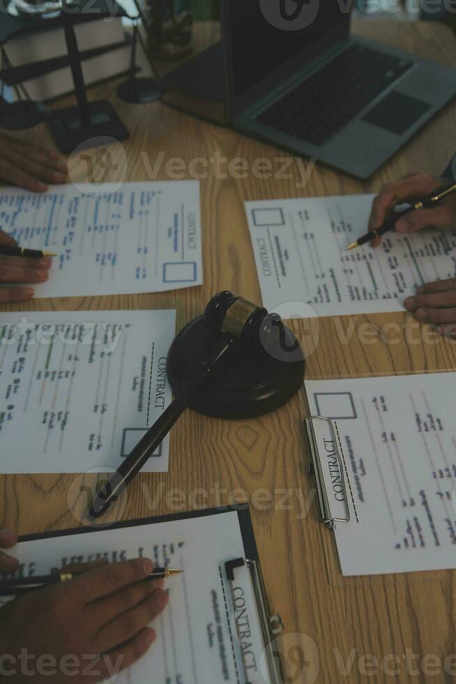 Consultation and conference of Male lawyers and professional businesswoman working and discussion having at law firm in office. Concepts of law, Judge gavel with scales of justice. photo