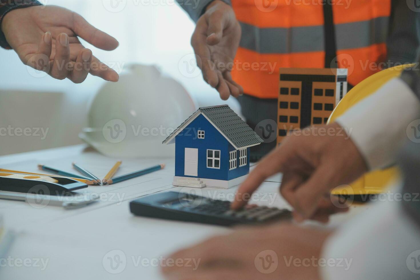 Construction and structure concept of Engineer or architect meeting for project working with partner and engineering tools on model building and blueprint in working site, contract for both companies. photo