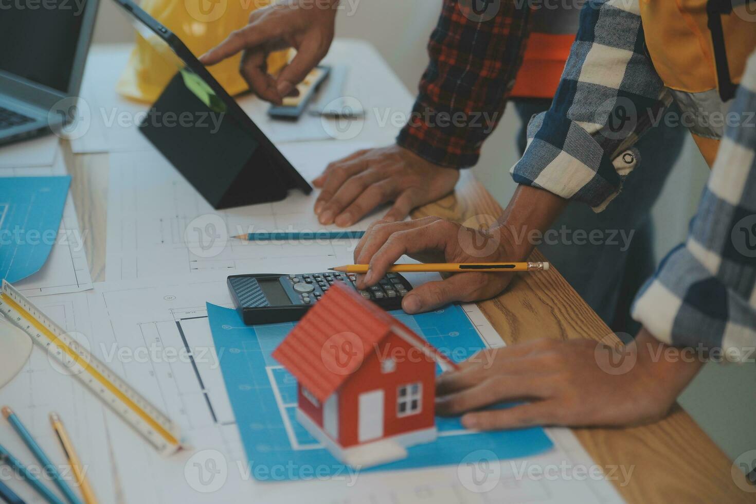 Construction and structure concept of Engineer or architect meeting for project working with partner and engineering tools on model building and blueprint in working site, contract for both companies. photo