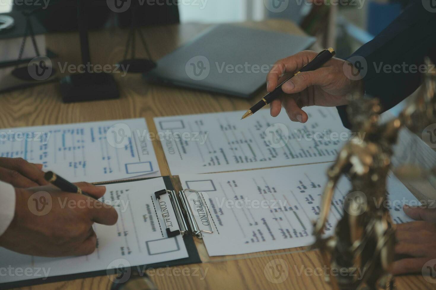 Consultation and conference of Male lawyers and professional businesswoman working and discussion having at law firm in office. Concepts of law, Judge gavel with scales of justice. photo