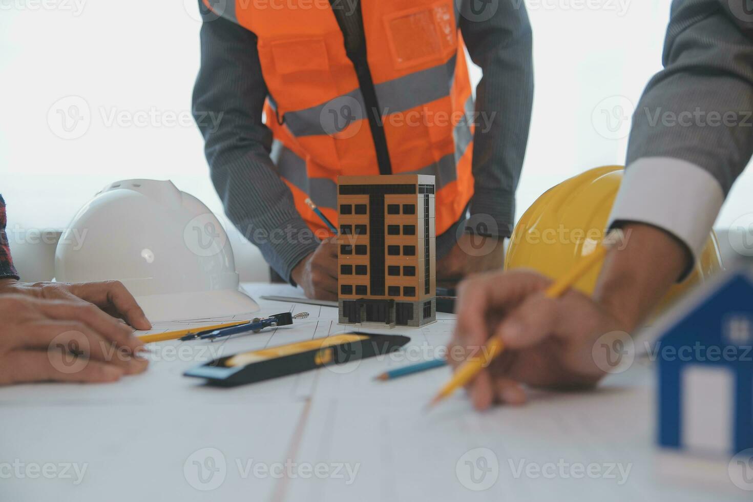 Construction and structure concept of Engineer or architect meeting for project working with partner and engineering tools on model building and blueprint in working site, contract for both companies. photo