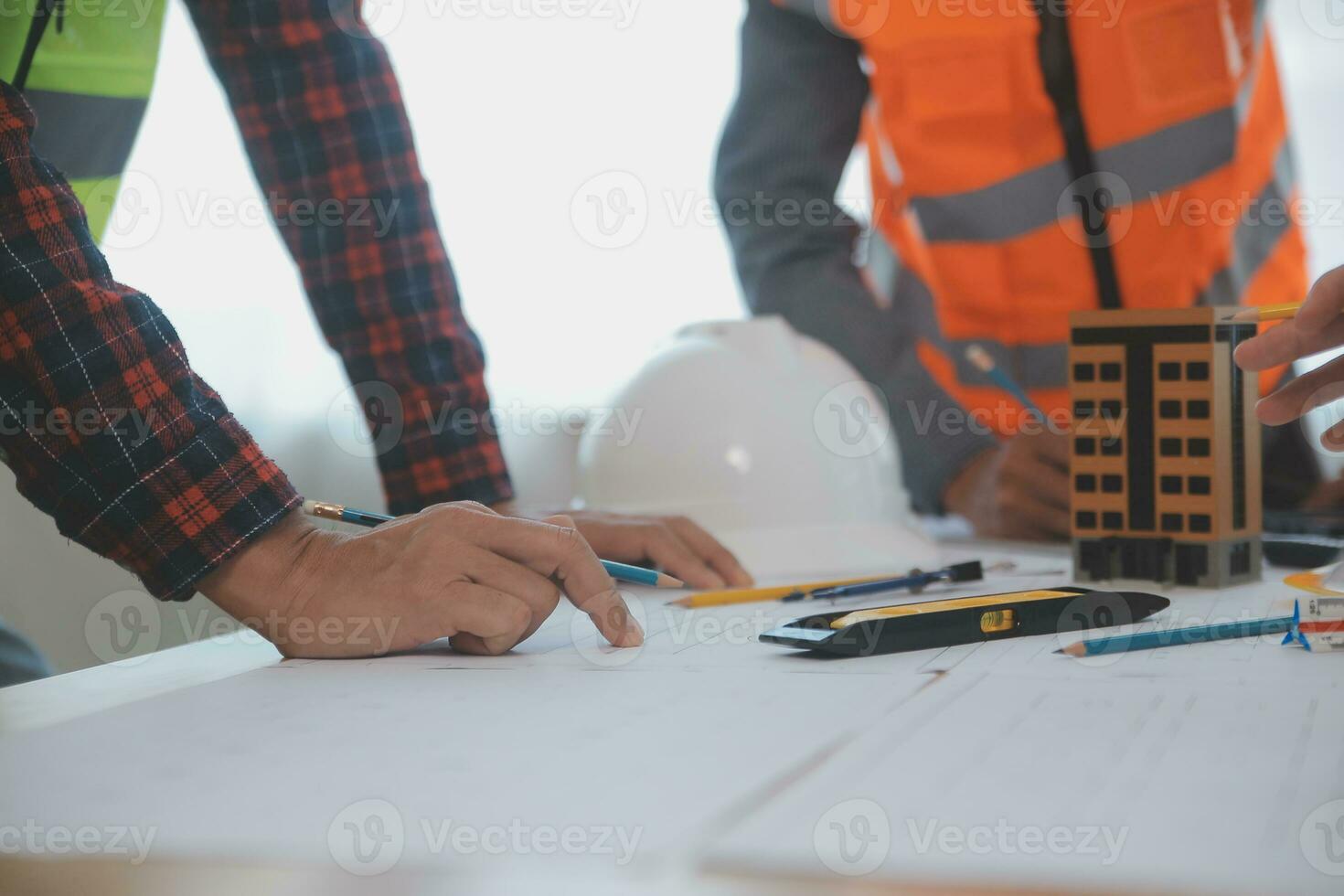 Construction and structure concept of Engineer or architect meeting for project working with partner and engineering tools on model building and blueprint in working site, contract for both companies. photo