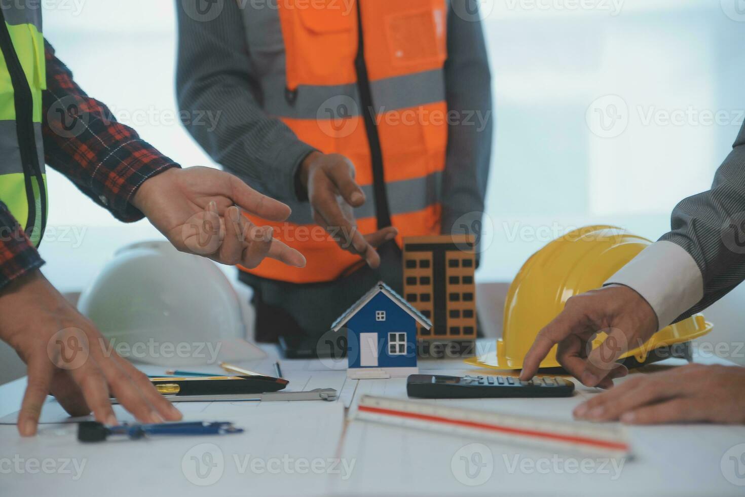 Construction and structure concept of Engineer or architect meeting for project working with partner and engineering tools on model building and blueprint in working site, contract for both companies. photo