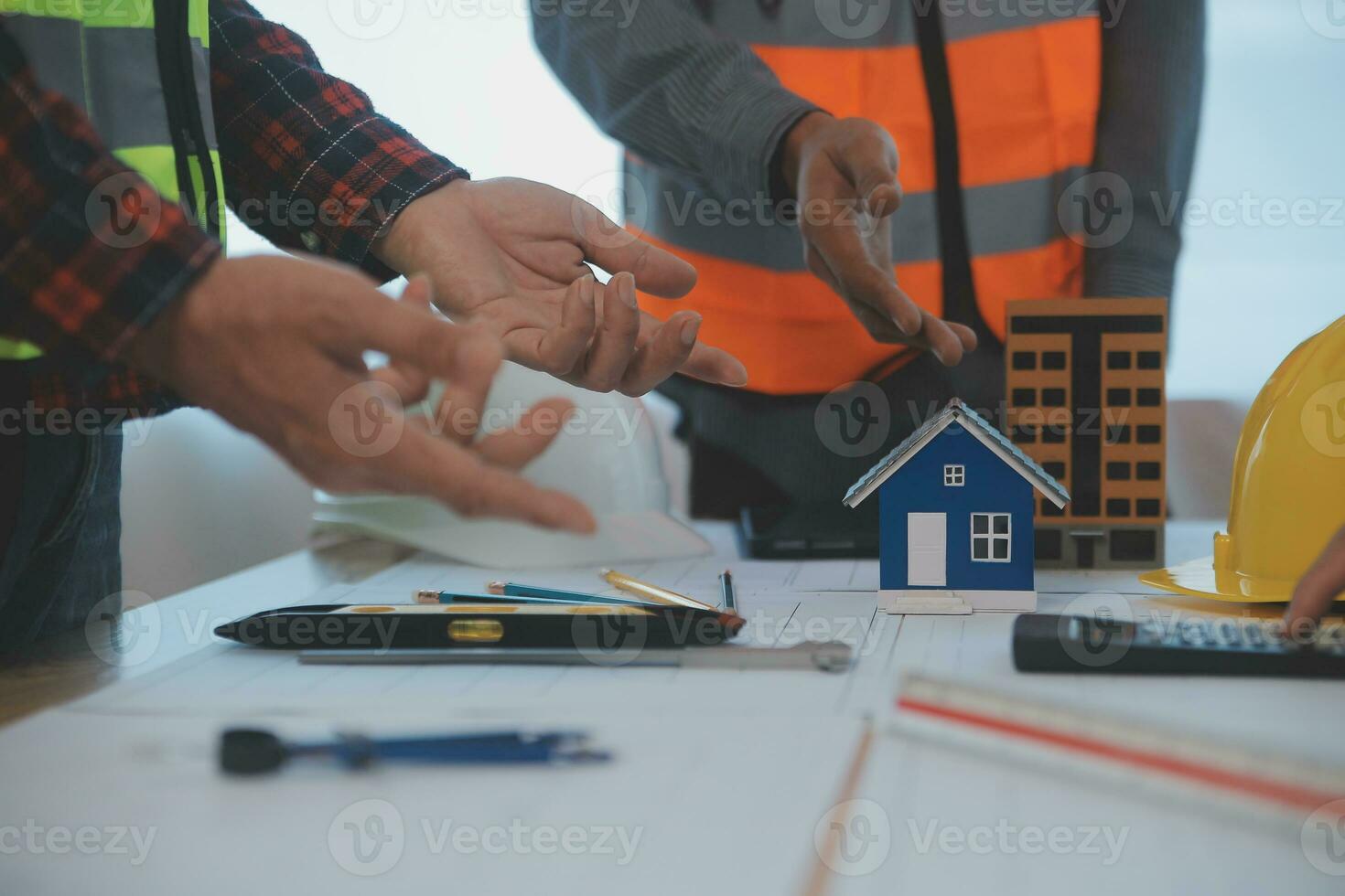 Construction and structure concept of Engineer or architect meeting for project working with partner and engineering tools on model building and blueprint in working site, contract for both companies. photo