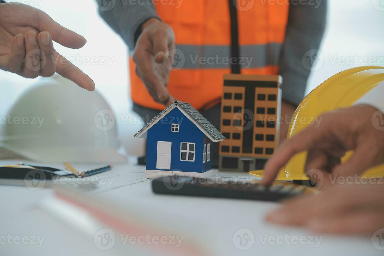 Construction and structure concept of Engineer or architect meeting for project working with partner and engineering tools on model building and blueprint in working site, contract for both companies. photo