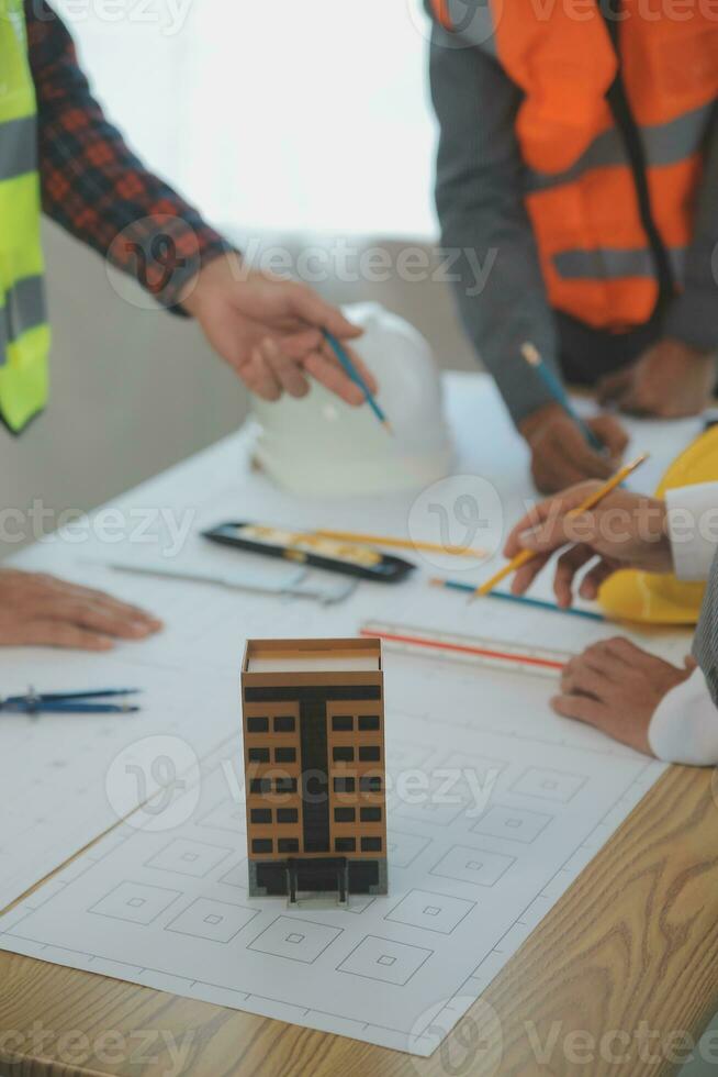 Construction and structure concept of Engineer or architect meeting for project working with partner and engineering tools on model building and blueprint in working site, contract for both companies. photo