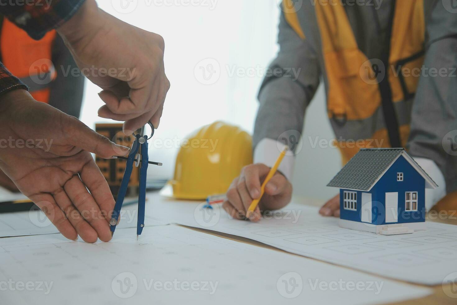 Construction and structure concept of Engineer or architect meeting for project working with partner and engineering tools on model building and blueprint in working site, contract for both companies. photo