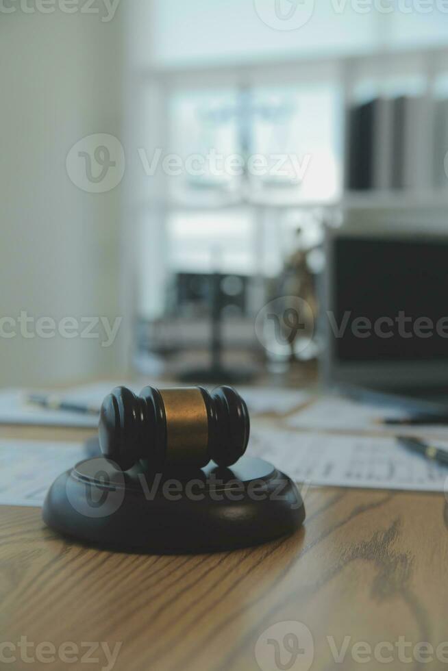 Consultation and conference of Male lawyers and professional businesswoman working and discussion having at law firm in office. Concepts of law, Judge gavel with scales of justice. photo