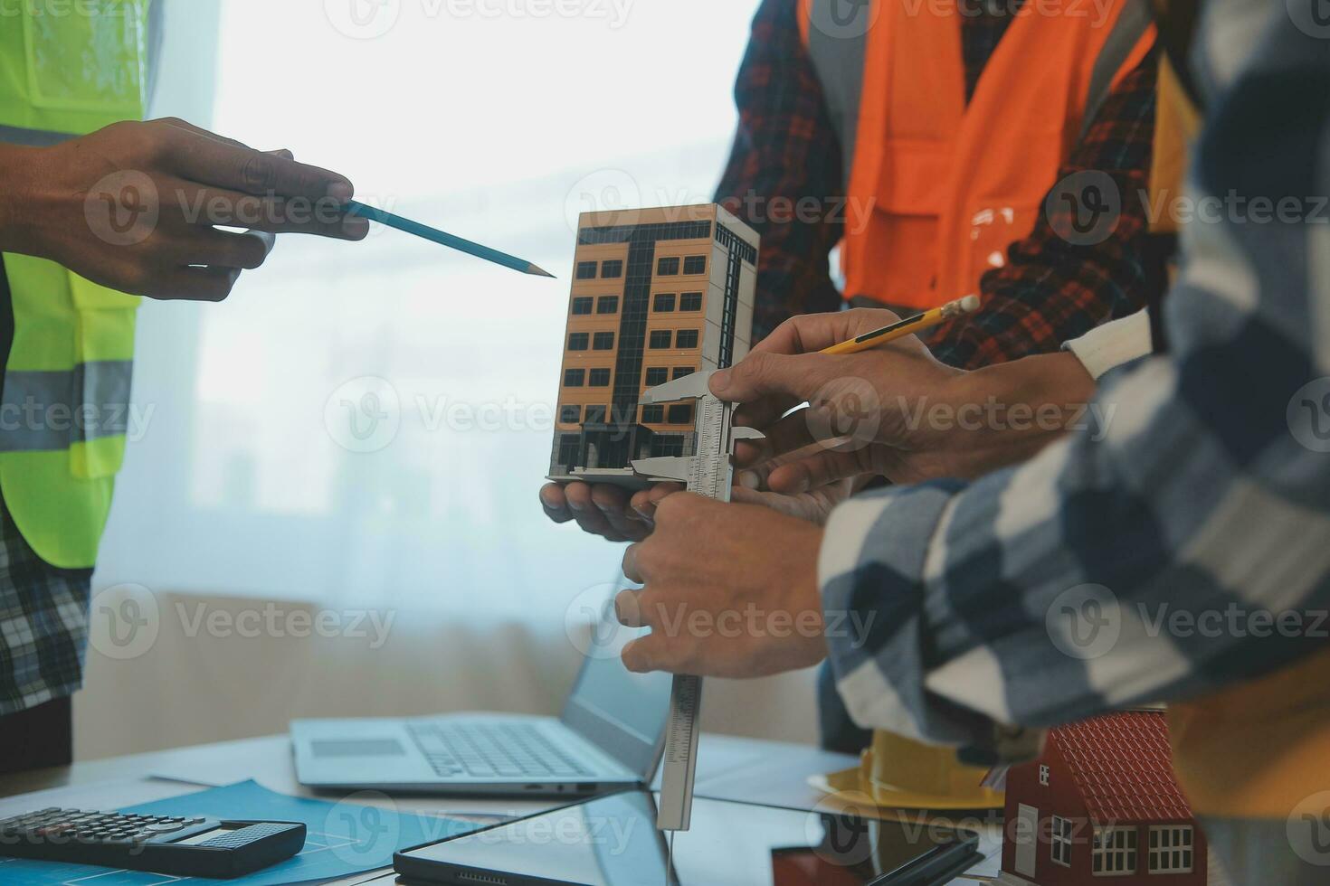 Construction and structure concept of Engineer or architect meeting for project working with partner and engineering tools on model building and blueprint in working site, contract for both companies. photo