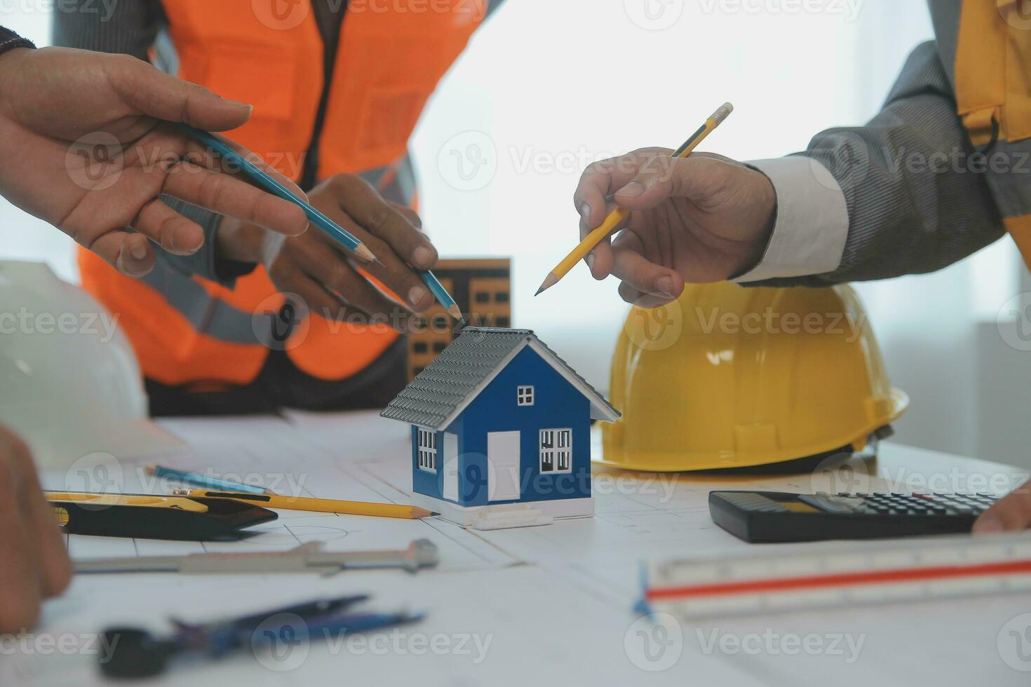 Construction and structure concept of Engineer or architect meeting for project working with partner and engineering tools on model building and blueprint in working site, contract for both companies. photo