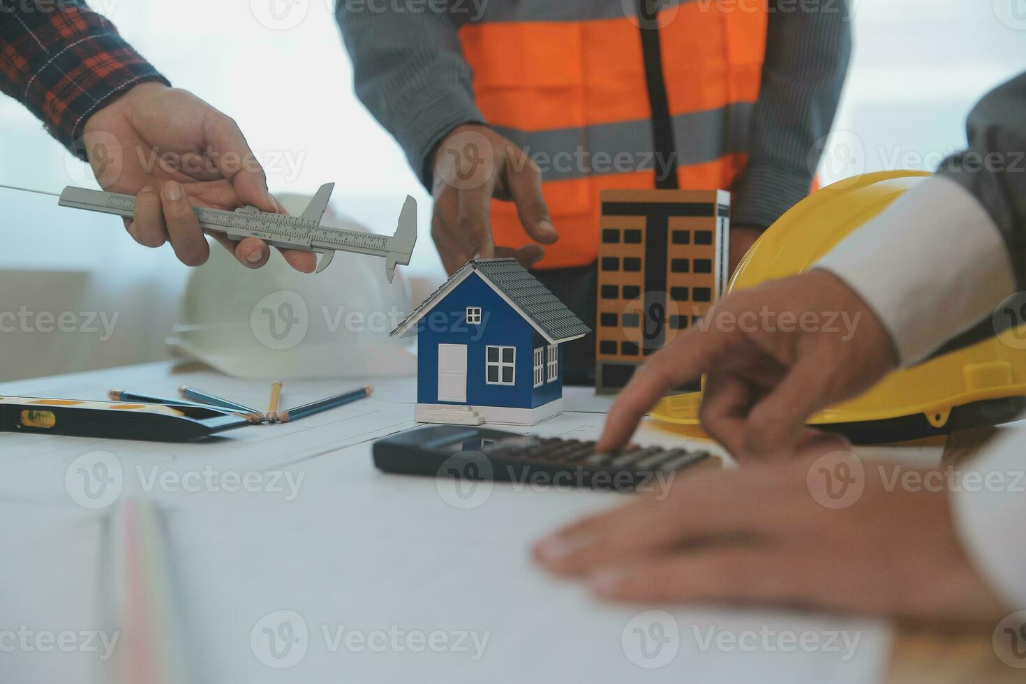 Construction and structure concept of Engineer or architect meeting for project working with partner and engineering tools on model building and blueprint in working site, contract for both companies. photo