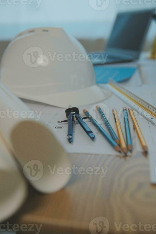 Construction and structure concept of Engineer or architect meeting for project working with partner and engineering tools on model building and blueprint in working site, contract for both companies. photo