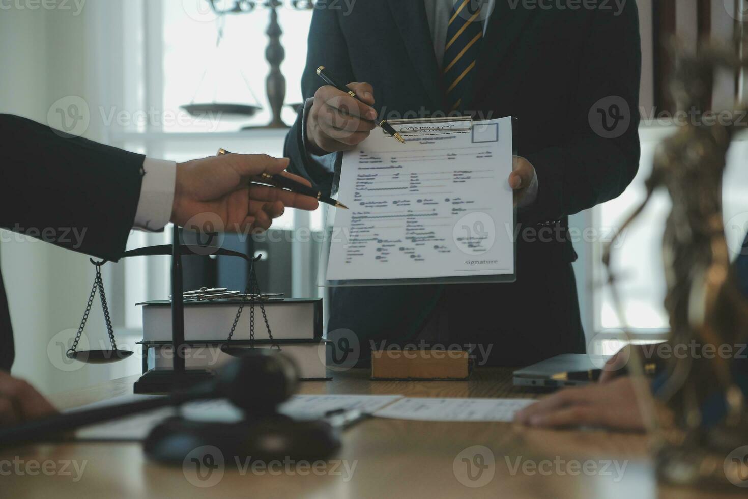 Consultation and conference of Male lawyers and professional businesswoman working and discussion having at law firm in office. Concepts of law, Judge gavel with scales of justice. photo