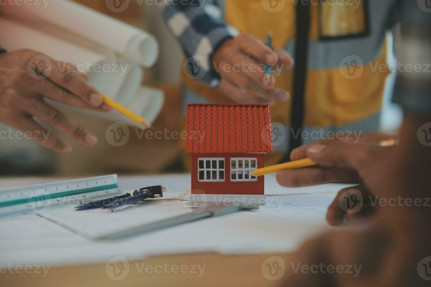Construction and structure concept of Engineer or architect meeting for project working with partner and engineering tools on model building and blueprint in working site, contract for both companies. photo