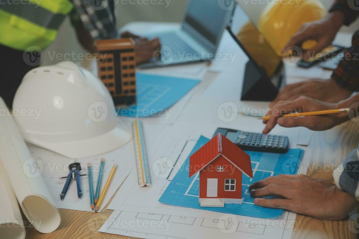 Construction and structure concept of Engineer or architect meeting for project working with partner and engineering tools on model building and blueprint in working site, contract for both companies. photo